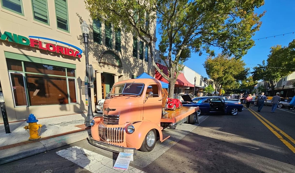 Classic cars and visitors at the 2023 Lake Mirror Classic Downtown Car Show in historic downtown Lakeland, Florida.