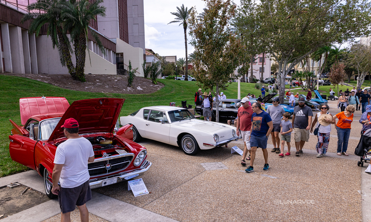 Classic show cars and visitors at the 2024 Lake Mirror Classic Concours d'Elegance, Lake Mirror Park, Lakeland, Florida.